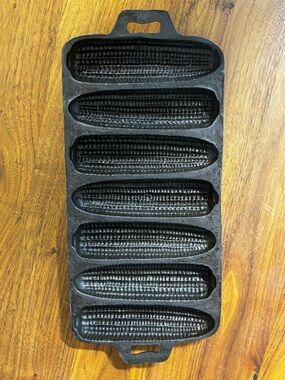 Vintage cast iron cornbread pan with 7 spaces